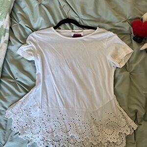 white t shirt with flared floral pattern on the bottom